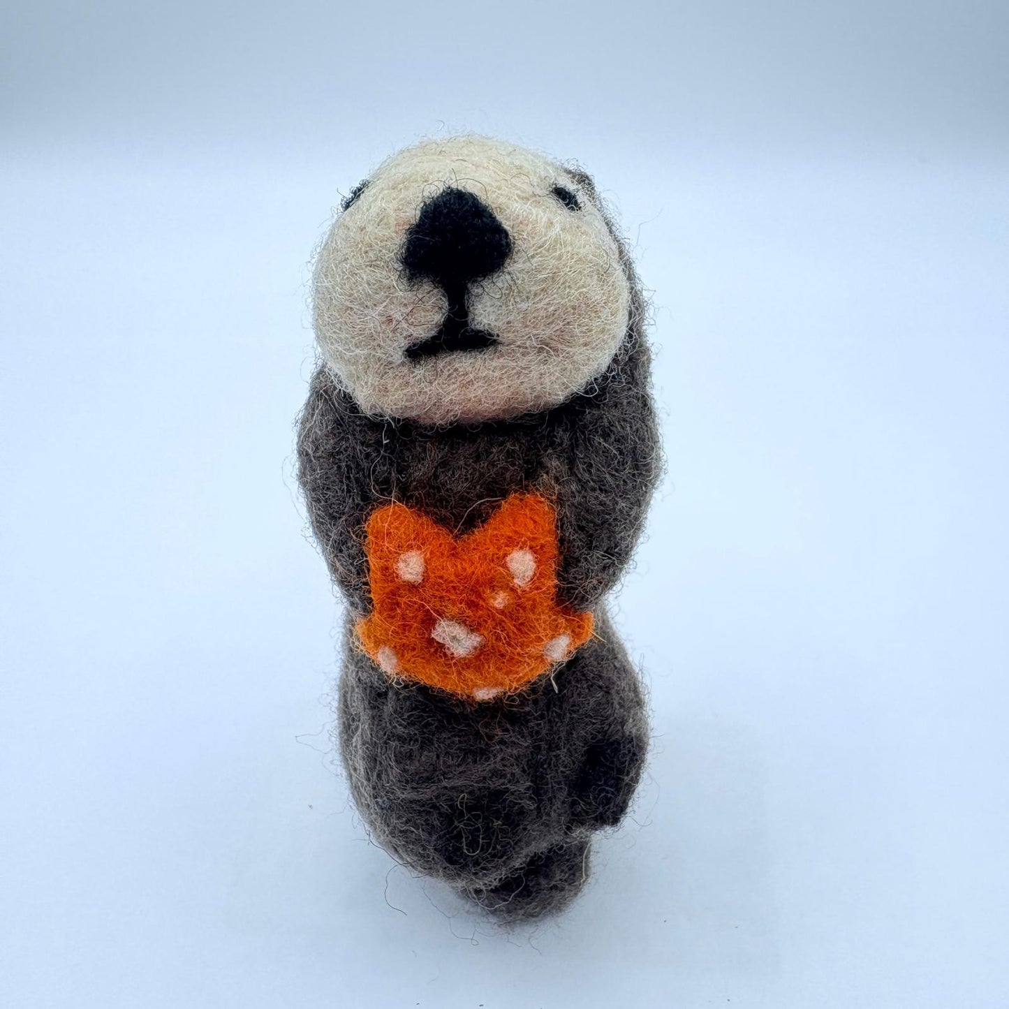 Otter with orange sea star