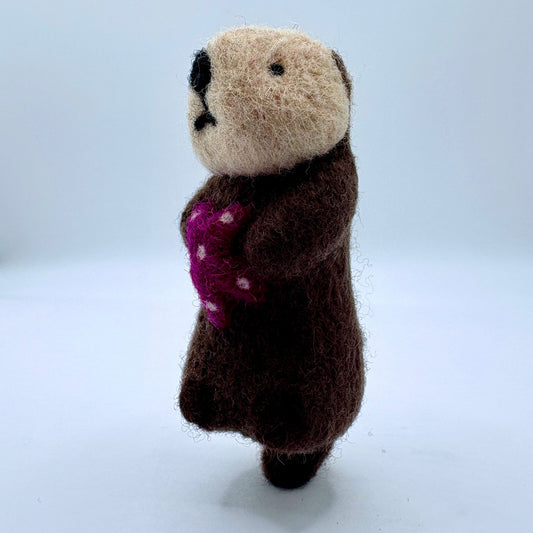 Otter with purple sea star