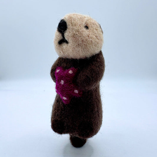 Otter with purple sea star