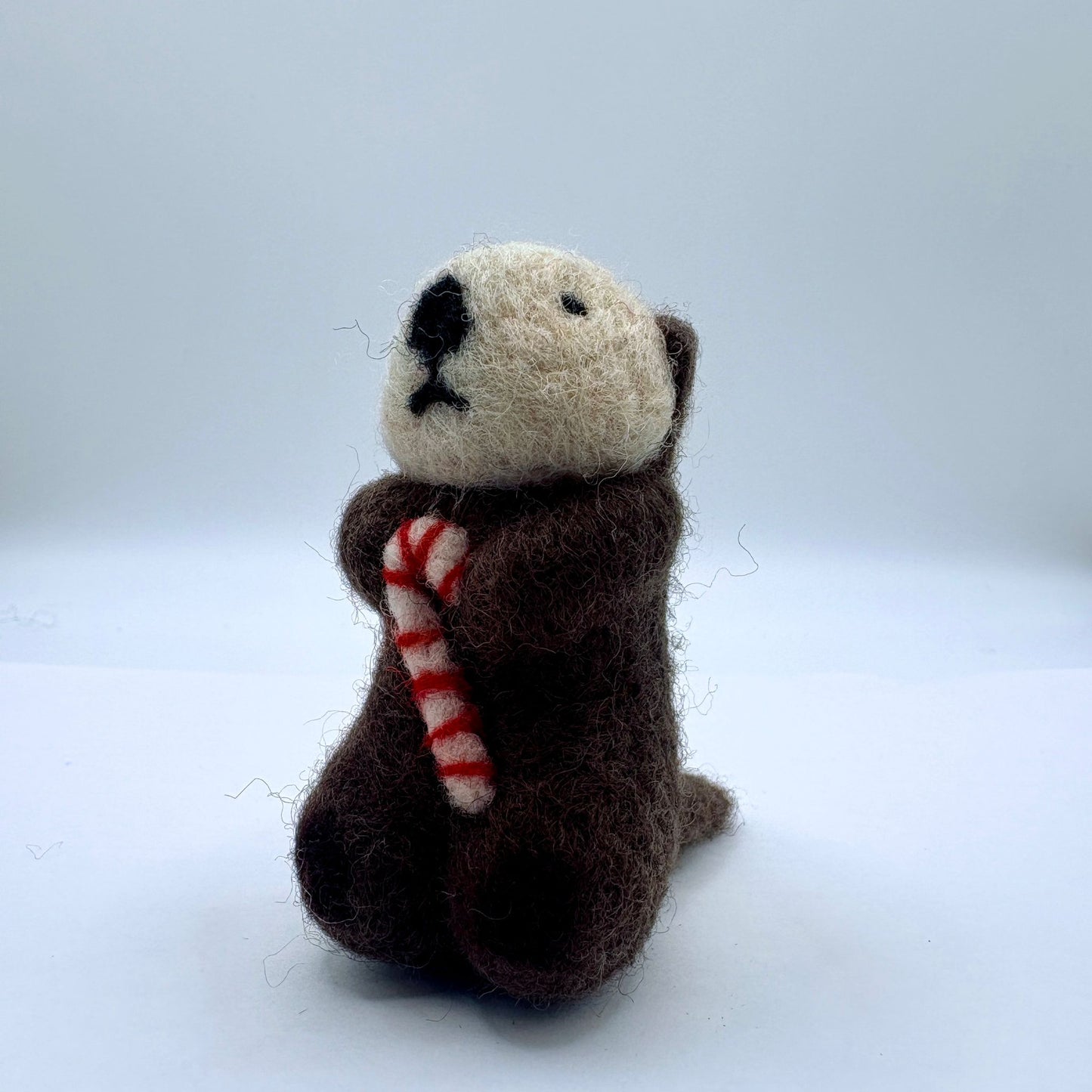 Otter with candy cane