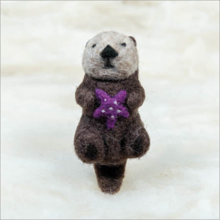 Otter with purple sea star