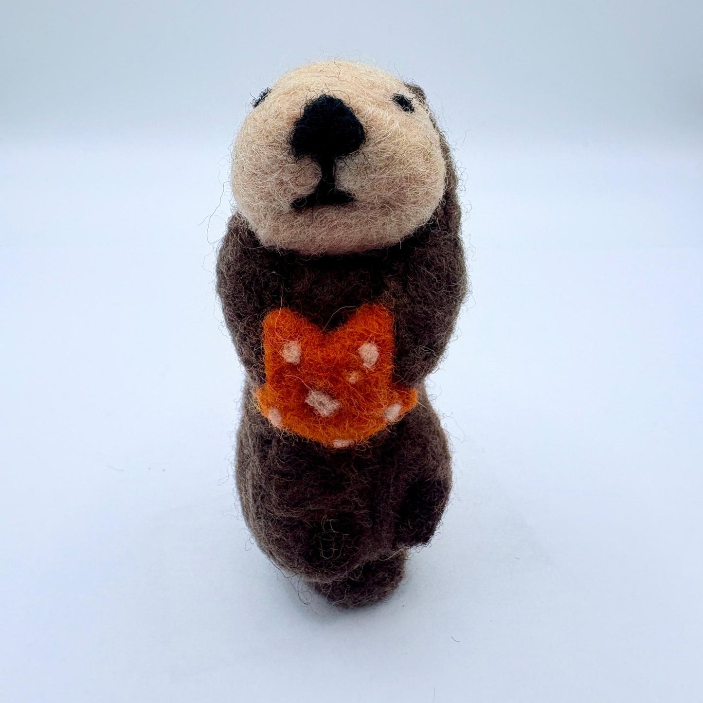 Otter with orange sea star