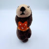 Otter with orange sea star