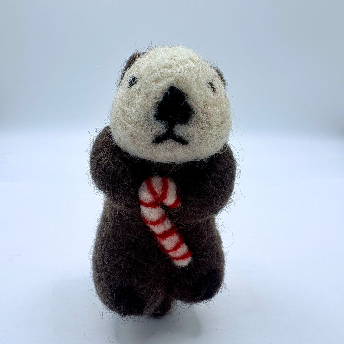Otter with candy cane