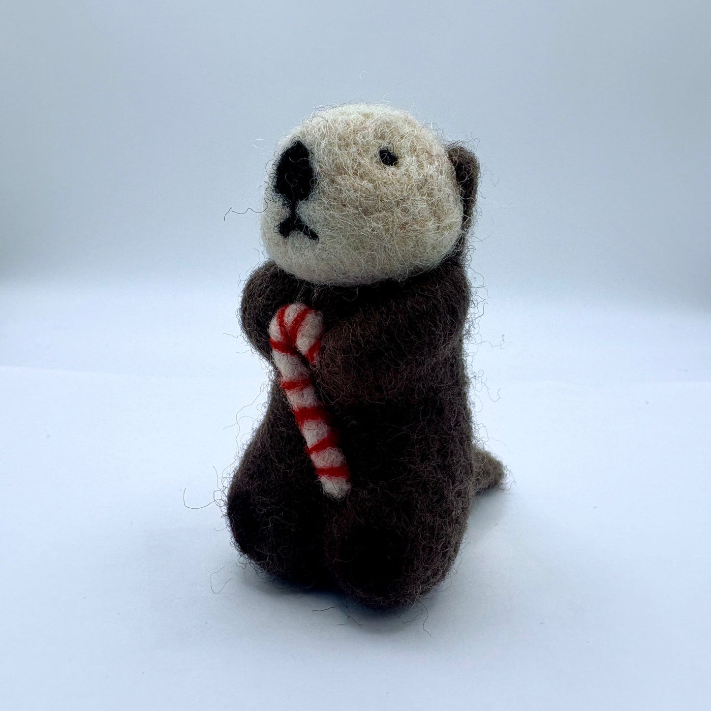 Otter with candy cane